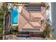 Aerial view of a private backyard pool, red tile roof, desert landscaping, and solar panels at 2329 Quartz Peak St, Las Vegas, NV 89134