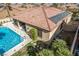 Aerial view of backyard with private pool, covered patio, and solar panels at 2329 Quartz Peak St, Las Vegas, NV 89134