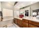 Bright bathroom with double sinks, tub and plants at 2329 Quartz Peak St, Las Vegas, NV 89134