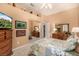 Comfortable bedroom with a large mirror closet and ceiling fan at 2329 Quartz Peak St, Las Vegas, NV 89134