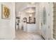 Elegant foyer with tile flooring, decorative glass door, and views of the dining room at 2329 Quartz Peak St, Las Vegas, NV 89134