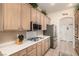 Bright kitchen with stainless steel appliances and light wood cabinets at 2329 Quartz Peak St, Las Vegas, NV 89134