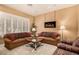 Relaxing living room offers plantation shutters, neutral colors, and decorative accents at 2329 Quartz Peak St, Las Vegas, NV 89134