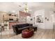 Open-concept living room with bar seating, tile flooring, and natural light at 2329 Quartz Peak St, Las Vegas, NV 89134