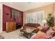 Bright living room boasts plantation shutters, plush furniture, and neutral tones at 2329 Quartz Peak St, Las Vegas, NV 89134