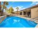 Inviting backyard pool with a water feature and mature landscaping at 2329 Quartz Peak St, Las Vegas, NV 89134