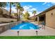 Inviting backyard pool with a water feature and mature landscaping at 2329 Quartz Peak St, Las Vegas, NV 89134