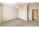 Bedroom has a carpeted floor, ceiling fan, and sliding door closet at 2554 Corvus St, Henderson, NV 89044