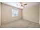 Cozy bedroom with natural light and a modern ceiling fan at 2554 Corvus St, Henderson, NV 89044