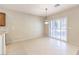 Kitchen eat-in area features tile flooring, a pendant light fixture, and sliding glass doors to the exterior at 2554 Corvus St, Henderson, NV 89044