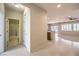 Bright, open living area with tile floors, a ceiling fan, and large windows that let in plenty of natural light at 2554 Corvus St, Henderson, NV 89044