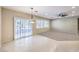 Living room featuring access to the exterior, tile flooring, and a ceiling fan at 2554 Corvus St, Henderson, NV 89044