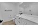 Modern bathroom featuring a white vanity, mirror, and tile backsplash at 2607 Aversa St, Henderson, NV 89044