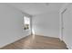 Bright bedroom featuring wood-look floors, neutral walls, and neighborhood view at 2607 Aversa St, Henderson, NV 89044