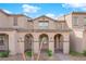 Well-maintained townhome with stucco facade and desert landscaping at 2607 Aversa St, Henderson, NV 89044