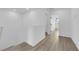 Second floor hallway with plank floors and bright white walls at 2607 Aversa St, Henderson, NV 89044