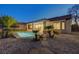 Backyard with desert landscaping and mature palm trees at 2820 Thunder Bay Ave, Henderson, NV 89052