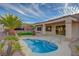 Outdoor living is defined by this backyard with a small pool, a covered patio, and desert landscaping that brings life to nature at 2820 Thunder Bay Ave, Henderson, NV 89052