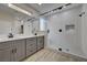 Modern bathroom featuring dual sinks, a glass shower with a built-in seat, and stylish fixtures at 2820 Thunder Bay Ave, Henderson, NV 89052