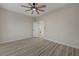 Bedroom with wood floors, a ceiling fan, and an open door to a connecting room at 2820 Thunder Bay Ave, Henderson, NV 89052