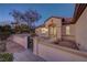 Inviting front entrance with a wrought-iron gate and manicured desert landscaping at 2820 Thunder Bay Ave, Henderson, NV 89052