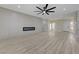 Spacious living room featuring a modern fireplace and stylish ceiling fan at 2820 Thunder Bay Ave, Henderson, NV 89052