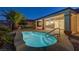 Backyard pool with easy access to the home, surrounded by desert landscaping and palm trees at 2820 Thunder Bay Ave, Henderson, NV 89052