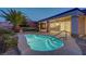 A backyard pool and patio surrounded by tropical landscaping for outdoor enjoyment at 2820 Thunder Bay Ave, Henderson, NV 89052