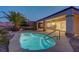 Backyard pool with easy access to the home, surrounded by desert landscaping and palm trees at 2820 Thunder Bay Ave, Henderson, NV 89052