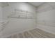 Empty walk-in closet with wire shelving and light wood-look floors at 2820 Thunder Bay Ave, Henderson, NV 89052