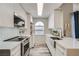 Bright kitchen with white cabinets, stainless steel appliances and a farmhouse sink at 3150 Soft Breezes Dr # 2022, Las Vegas, NV 89128