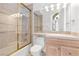 Well-lit bathroom with shower over tub, and wooden cabinets at 379 Turquoise Ct, Boulder City, NV 89005