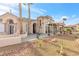 Beautiful desert landscaped home with a grand entrance featuring palm trees and stone accents at 379 Turquoise Ct, Boulder City, NV 89005