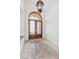 Elegant foyer featuring a decorative glass door, marble flooring and a stylish chandelier at 379 Turquoise Ct, Boulder City, NV 89005