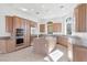 Spacious kitchen with custom wood cabinets, granite countertops, stainless steel appliances and kitchen island at 379 Turquoise Ct, Boulder City, NV 89005