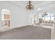 Bright living room with chandelier and seamless transitions to the outdoor landscape at 379 Turquoise Ct, Boulder City, NV 89005