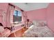 Cute, quirky bedroom with colorful decor, a bed, and a desk at 3916 Rhine Way, Las Vegas, NV 89108