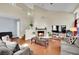 Bright living room with high ceilings, a fireplace, wood floors, and comfortable seating at 3916 Rhine Way, Las Vegas, NV 89108