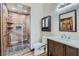 Modern bathroom featuring a glass-enclosed shower with rainfall shower head and a sleek vanity at 4075 E Oquendo Rd, Las Vegas, NV 89120