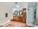 Bright bathroom with a jetted tub, separate shower, and dual vanities at 4075 E Oquendo Rd, Las Vegas, NV 89120