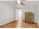 Cozy bedroom featuring wood floors, a ceiling fan, and a wooden dresser at 4075 E Oquendo Rd, Las Vegas, NV 89120