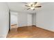 This bedroom features wood-look floors, base trim and neutral walls at 4075 E Oquendo Rd, Las Vegas, NV 89120