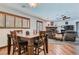 Cozy dining area with a wooden table and chairs, connected to a comfortable living space at 4075 E Oquendo Rd, Las Vegas, NV 89120