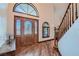 Elegant foyer with wood-look floors, stained glass door, and decorative trim at 4075 E Oquendo Rd, Las Vegas, NV 89120