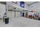 Spacious garage with a high ceiling and two large garage doors at 4075 E Oquendo Rd, Las Vegas, NV 89120