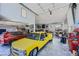 Extensive garage showcasing multiple vehicles, tools, and organized storage solutions at 4075 E Oquendo Rd, Las Vegas, NV 89120