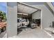 Partially open garage showcases boat, classic car, and ample storage space at 4075 E Oquendo Rd, Las Vegas, NV 89120