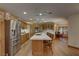 Spacious kitchen features wooden cabinets, stainless steel appliances and white counters at 4075 E Oquendo Rd, Las Vegas, NV 89120