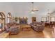 Spacious living room featuring hardwood floors, fireplace, and two plush sofas at 4075 E Oquendo Rd, Las Vegas, NV 89120