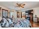 Tranquil main bedroom with a fireplace, wood floors, and an ensuite bathroom at 4075 E Oquendo Rd, Las Vegas, NV 89120